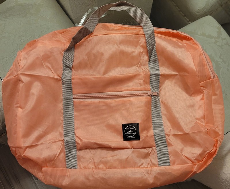 NWOT WIND BLOWS RIVER FLOWS PEACH LIGHT WEIGHT OVERNIGHT BAG. Created By Travel.