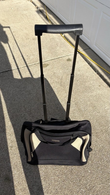 Concourse Black/Beige Solid Carry-On Rolling Duffel Bag Retractable Handle gallery