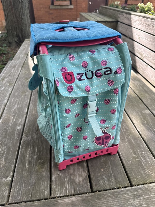 zuca Sport Pink Frame Blue LadyBug Insert Upright rolling wheel school suitcase