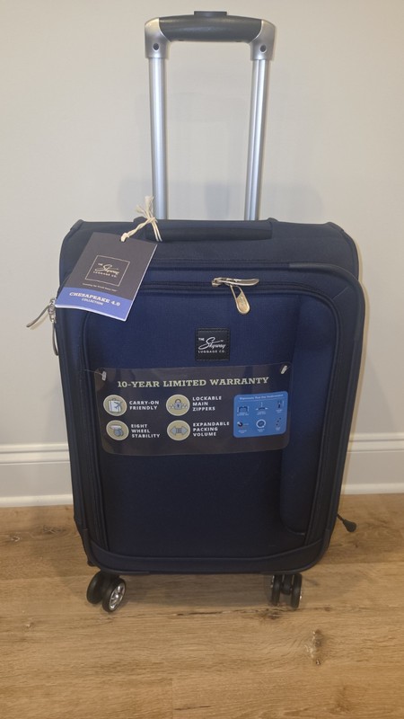 The Skyway Luggage Co. 20″ Navy Blue Spinner Carry-On Eight Wheel Expandable