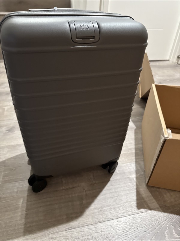 NEW In Box Beis Regular Carry-On Roller Charcoal 22" $268 MSRP. gallery
