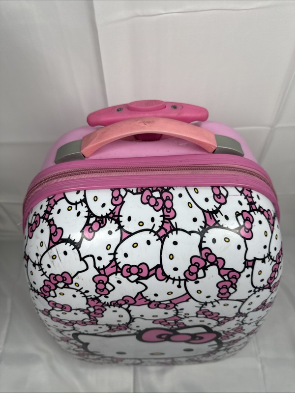 Hello Kitty Sanrio Hard Shell Rolling Carry On Luggage 18” All Over Kitty Print gallery