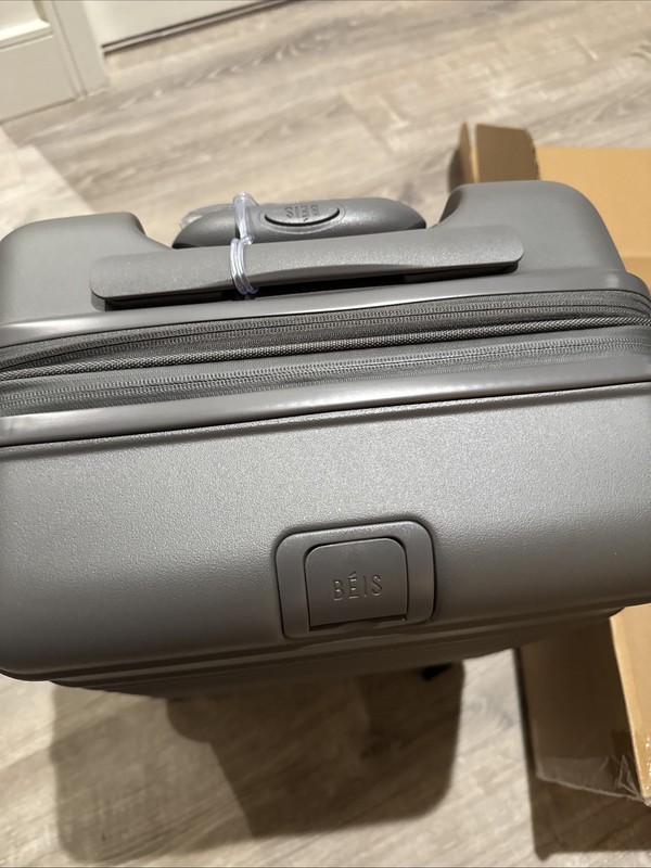 NEW In Box Beis Regular Carry-On Roller Charcoal 22" $268 MSRP. gallery