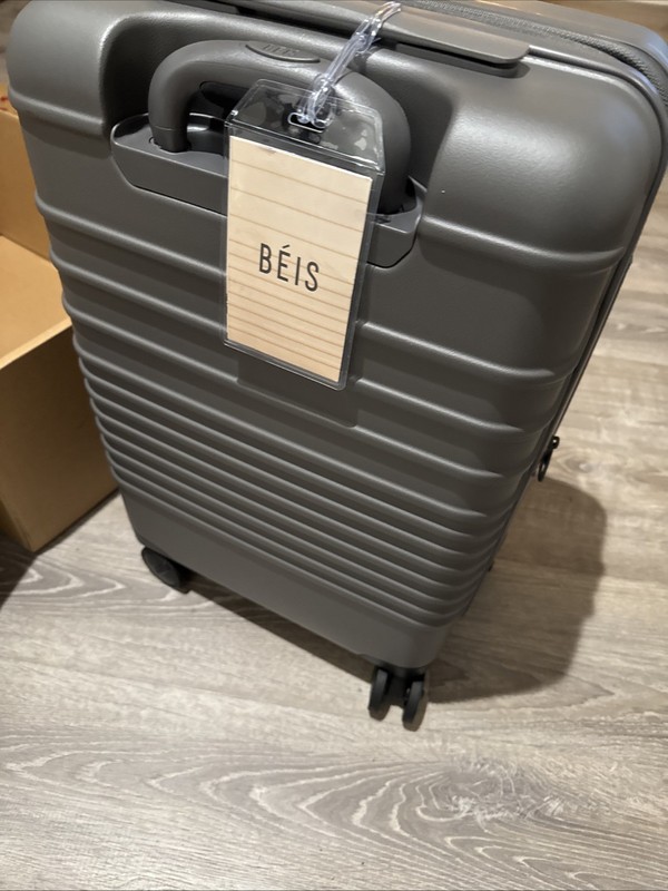NEW In Box Beis Regular Carry-On Roller Charcoal 22" $268 MSRP. gallery