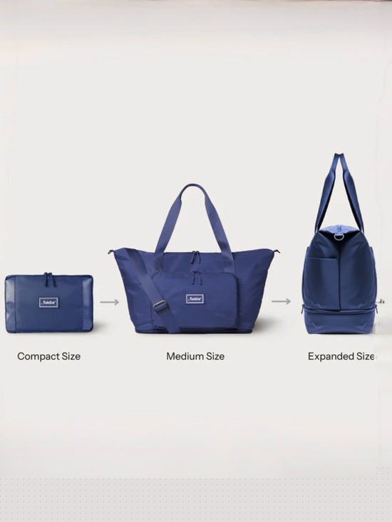 NWT The Foldie Expandable Travel Bag Navy retail $179 gallery