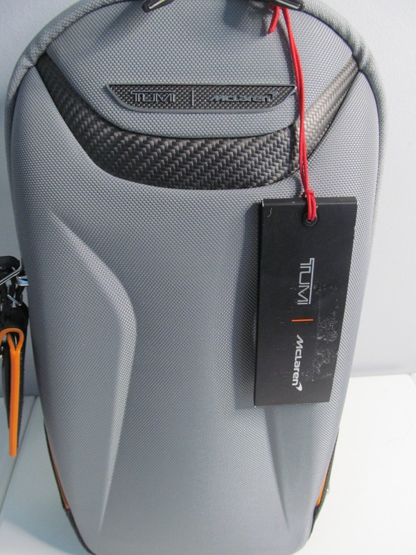 TUMI/McLaren Touque 14″ Sling Crossbody Backpack-Gray & Papaya Orange, $650. NWT